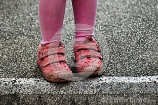 child-feet-old-stone-block-red-sneakers-urchin-style-crossing-white-line-edge-contrast-colors-close-up-hesitating-54809535